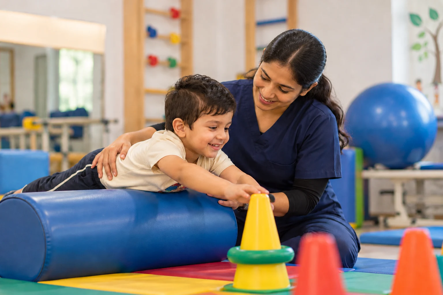 Therapist helping a child with a movement activity at a paediatric physiotherapy centre in Delhi